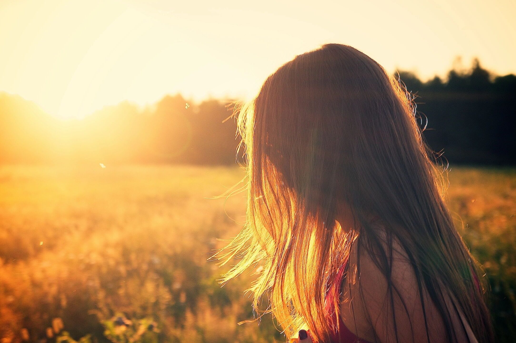 Unknown image of girl against sunset