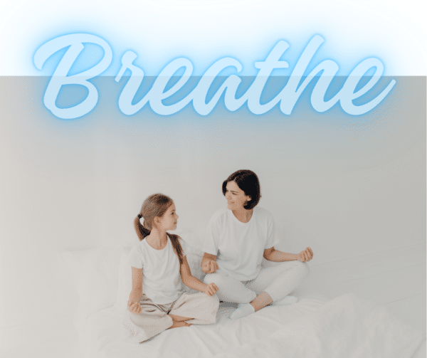 mom daughter in meditation pose with breathe written at the top
